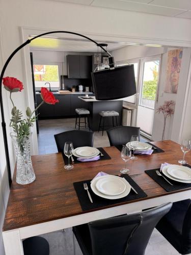 a dining room table with plates and glasses on it at Apartment Prinz Luis in Owingen