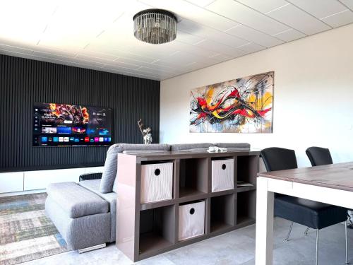 a living room with a couch and a table at Apartment Prinz Luis in Owingen