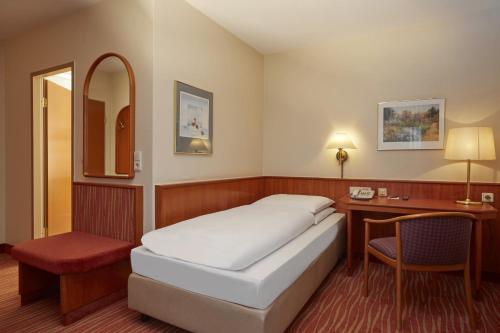 เตียงในห้องที่ Novum Hotel Mannheim City