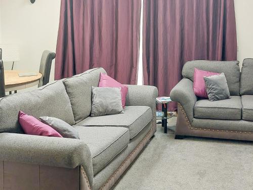 a living room with a couch and a chair at Mountshade in Finzean