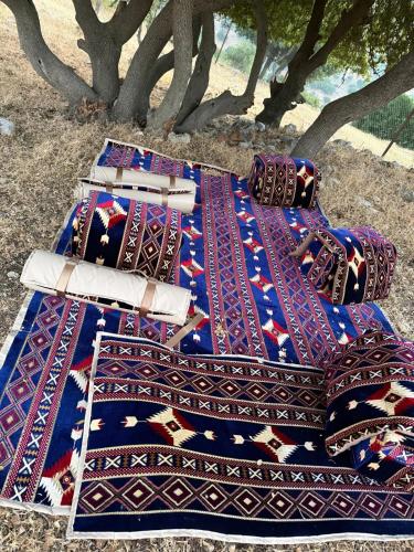 a group of three beds sitting on the ground at Waatad in Irbid