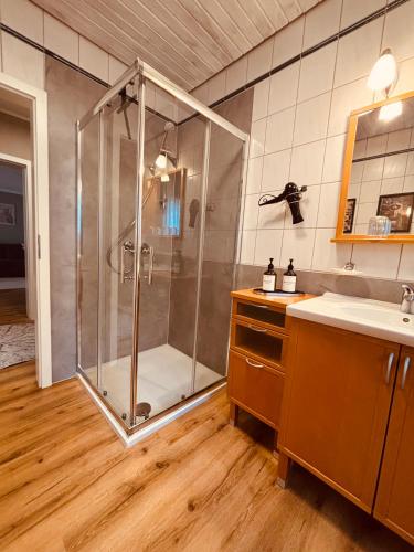 a bathroom with a shower and a sink at Ferienwohnung De Lorenzi in Boppard