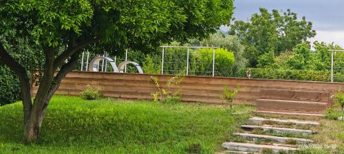 a retaining wall with stairs in a yard at Domus DEA Holiday Home in Pompei