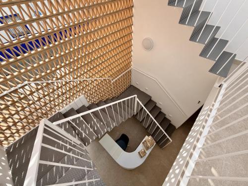 an overhead view of a staircase in a building at Villa Julia Apartamentos in Chipiona