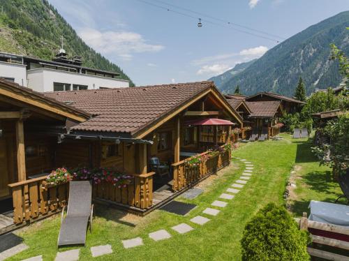 a group of buildings with mountains in the background at Haus Martinus in Mayrhofen