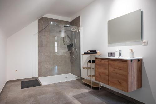 a bathroom with a shower and a sink at Horse Valley in Tongeren