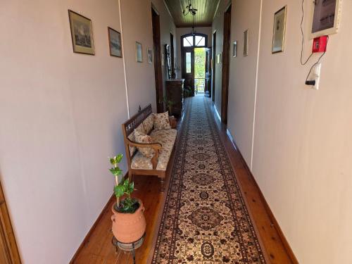 a hallway with a couch and a rug at Arhodico Simou mansion in Kambos