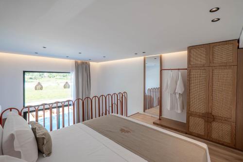 a bedroom with a bed and a balcony at Maesa Suite in Borsh