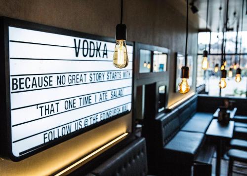a sign on the wall of a restaurant at Malmaison Edinburgh in Edinburgh