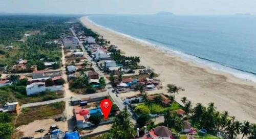 an aerial view of a beach with a red balloon at Casa De Playa in Agua de Correa