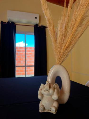 a figurine of a child sitting in a letter e at Altos del Pissis I in Tinogasta