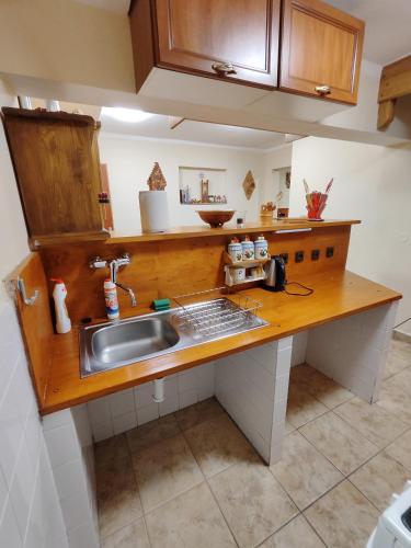 a kitchen with a sink and a counter top at Chata Kopánka in Moderštôlňa