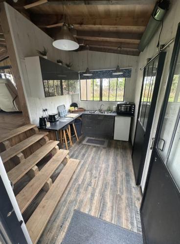 a kitchen with a table and chairs in a house at Scarthingmoor Lodges in Weston