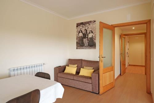 a bedroom with a bed and a couch in it at StaynFeel 04 in Fátima