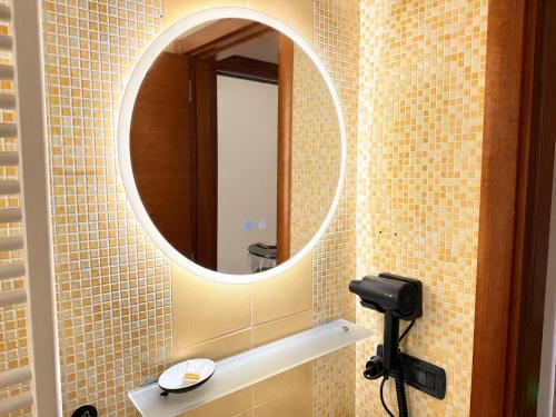 a bathroom with a mirror and a sink at Del Console Apartment 2 - Near Bari Airport & Station in Modugno