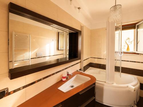 a bathroom with a sink and a bath tub at Del Console Garden Suite - Near Bari Airport & Station in Modugno