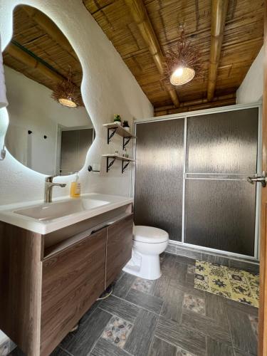 a bathroom with a sink and a toilet at Villa Mara in Filandia