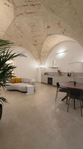 a large living room with a couch and a table at Casa Nacci Accoglienza di Lusso in Brindisi