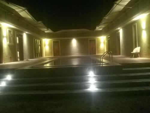 an empty swimming pool in a building at night at Lions adventure in Narok