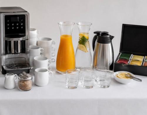 a counter with glasses and a coffee maker and a blender at apartmenttwelve in Trogir