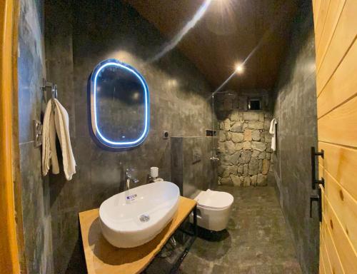 a bathroom with a sink and a toilet at Lavender Resort Naran in Naran
