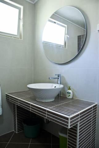 a bathroom with a sink and a mirror at Apartment Dunja Djenovici in Herceg-Novi