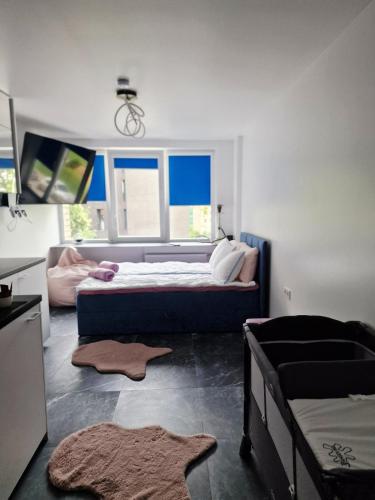 a bedroom with a large bed and a window at Moon Love in Pakopi