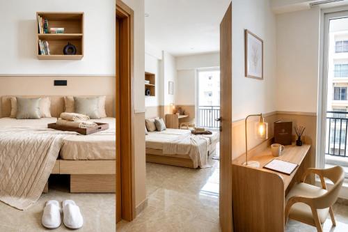 a bedroom with two beds and a desk and a mirror at AS Living Guest House - A boutique stay near Apollo Hospital, City Center Mall, PhysicsWallah, Allen, SPM in Guwahati