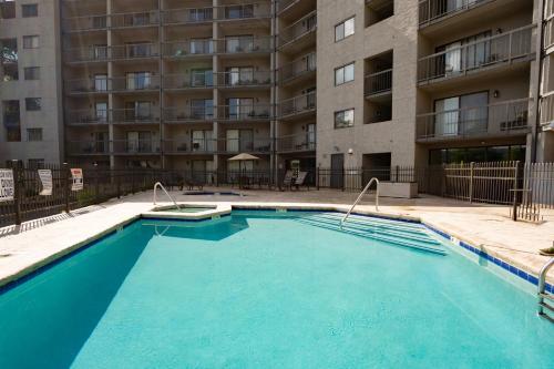 a swimming pool in front of a apartment building at Olde Gatlinburg Rentals in Gatlinburg