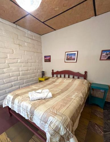 a bedroom with a large bed in a room at Hostal Humahuaca in Humahuaca