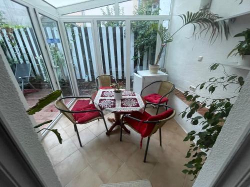 a balcony with a table and chairs in a room at Ferienwohnung Weinstrasse in Rostock