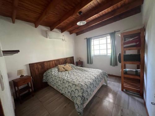 a bedroom with a bed and a window at EBC SUM&Aparts in San Miguel del Monte