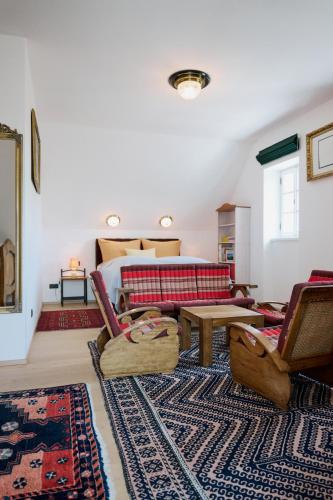 a living room with a couch and a table at Weingut Bleyweis in Kitzeck im Sausal