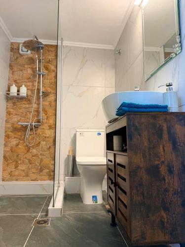 a bathroom with a sink and a shower at The View Xanthi in Xanthi