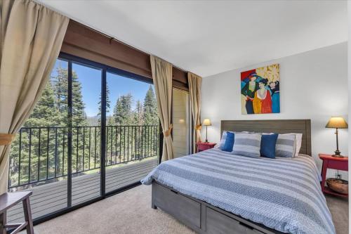 a bedroom with a bed and a balcony at Chez Vaupen in Alpine Meadows