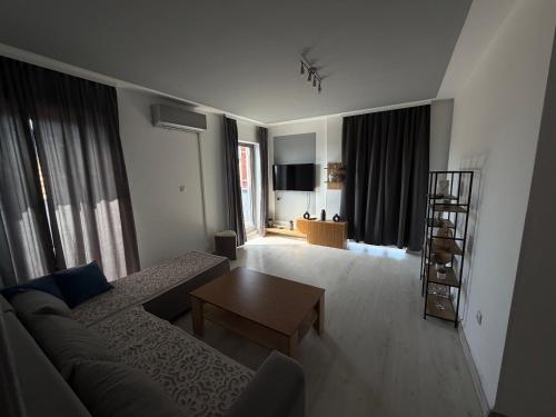 a living room with a couch and a table at Cartagena Urban Escape in Brčko
