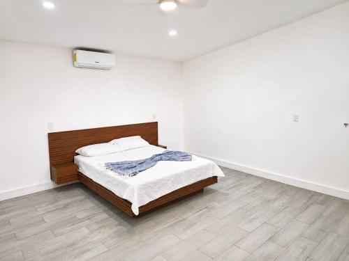 a bedroom with a bed in a white room at Villa Isora in Talamanca