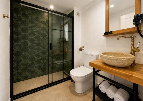 a bathroom with a shower and a toilet and a sink at Abelia Mansion Hotel in Istanbul
