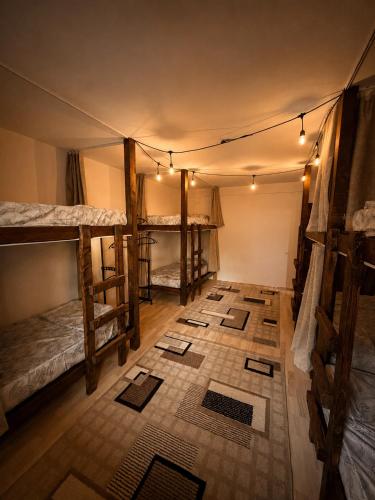 a room with bunk beds and mats on the floor at Pure Sleep in Prizren