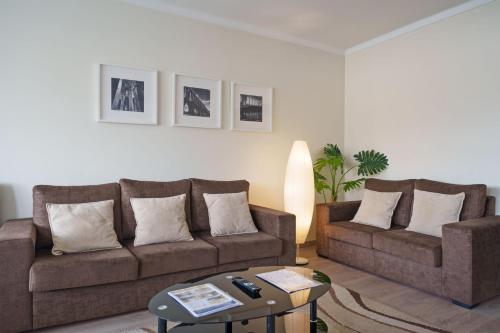 a living room with two couches and a coffee table at StaynFeel 03 in Fátima
