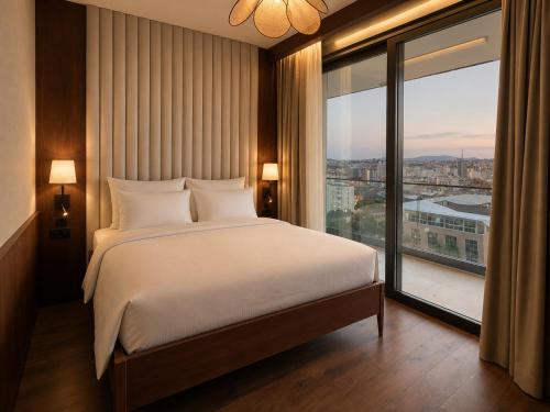 a bedroom with a large bed and a large window at Lusso Hotel in Prishtinë
