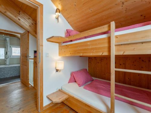 a bedroom with bunk beds in a tiny house at Heidi und Peter in Hohentauern