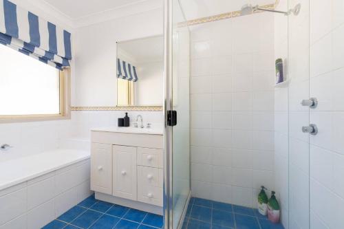 a bathroom with a shower and a sink at 3BR Guesthouse w Sunroom Near Stanhope Leisure in Glenwood
