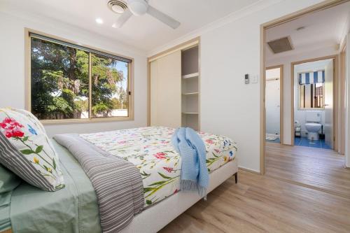 a bedroom with a bed and a large window at 3BR Guesthouse w Sunroom Near Stanhope Leisure in Glenwood