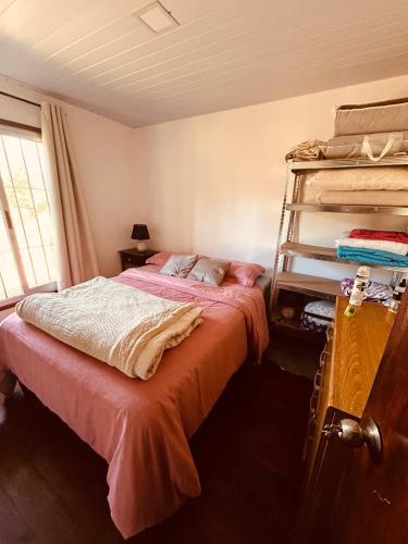 a bedroom with two bunk beds and a window at Tejanos in La Paloma