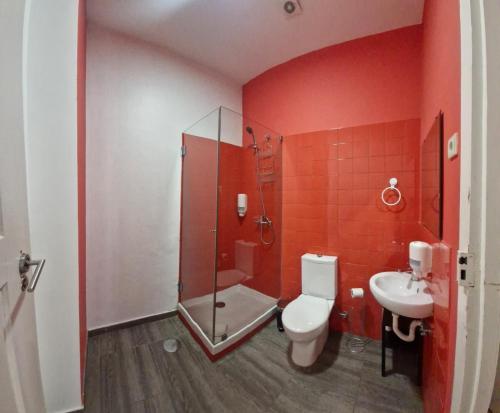 a bathroom with a shower and a toilet and a sink at Porto Republica Downtown in Porto