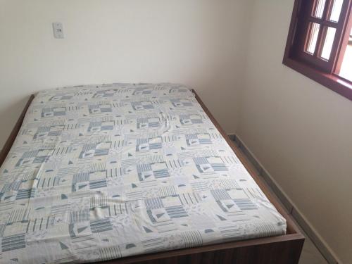Säng eller sängar i ett rum på Pousada Camacho