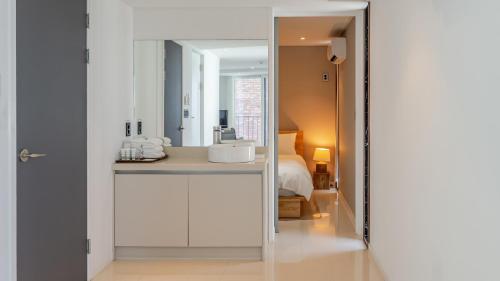 a bathroom with a sink and a mirror at Sokcho Moreve Pension in Sokcho