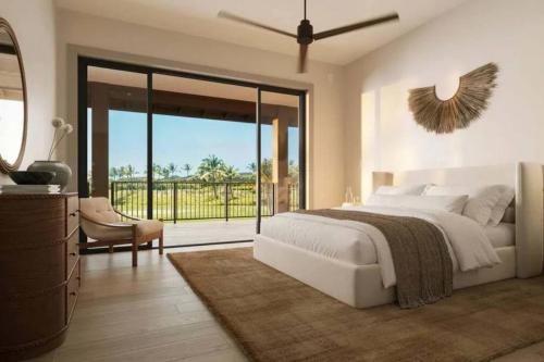 a bedroom with a large bed and a balcony at Villa Kahala Honolu With Pool in Honolulu