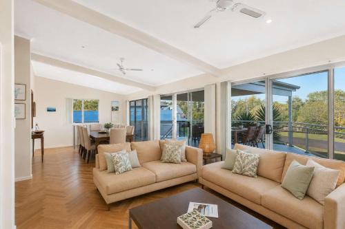 a living room with a couch and a table at Dream Weaver in Bawley Point